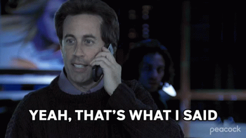 A Man Talking On A Cell Phone With The Words Yeah That 'S What I Said Behind Him GIF