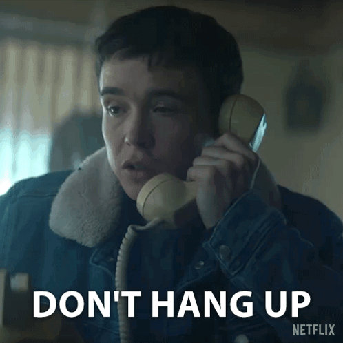 A Man Talking On A Phone With The Words " Do N't Hang Up " Written Below Him GIF