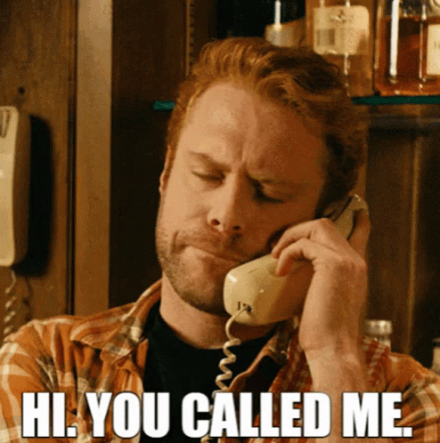 A Man Talking On A Phone With The Words Hi You Called Me GIF