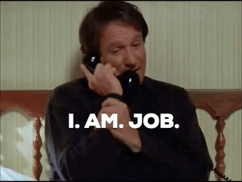 A Man Talking On A Phone With The Words " I Am Job " Written Below Him GIF