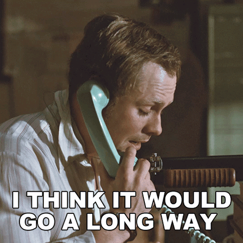 A Man Talking On A Phone With The Words " I Think It Would Go A Long Way " Above Him GIF