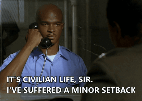 A Man Talking On A Phone With The Words " It 'S Civilian Life Sir I 'Ve Suffered A Minor Setback " GIF