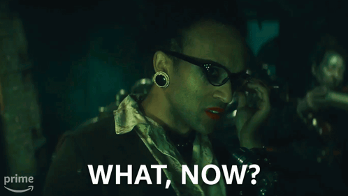 A Man Talking On A Phone With The Words What Now On The Bottom GIF