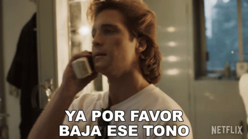 A Man Talking On A Phone With The Words Ya Por Favor Baja Ese Tono GIF