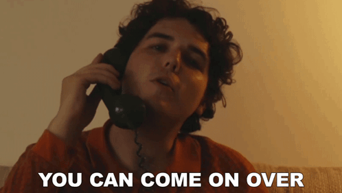 a man talking on a phone with the words " you can come on over " written below him