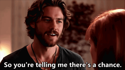 A Man Talking To A Woman With The Words So You 'Re Telling Me There 'S A Chance Written Below Him GIF