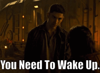 A Man Talking To A Woman With The Words " You Need To Wake Up " On The Bottom GIF