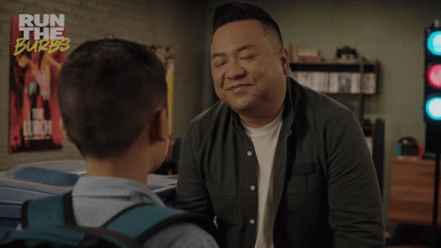 A Man Talking To A Young Boy With The Words " Life Is Hard " On The Bottom GIF