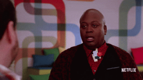 A Man Talking To Another Man With A Netflix Logo On The Bottom GIF