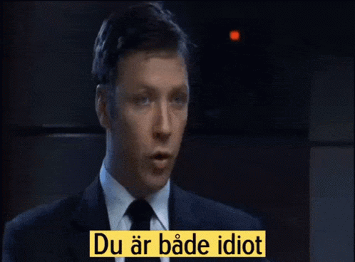 A Man Talking To Another Man With A Yellow Sign That Says Och Juvenil Full GIF