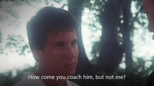 A Man Talking To Another Man With The Words " How Come You Coach Him But Not Me " Below Him GIF
