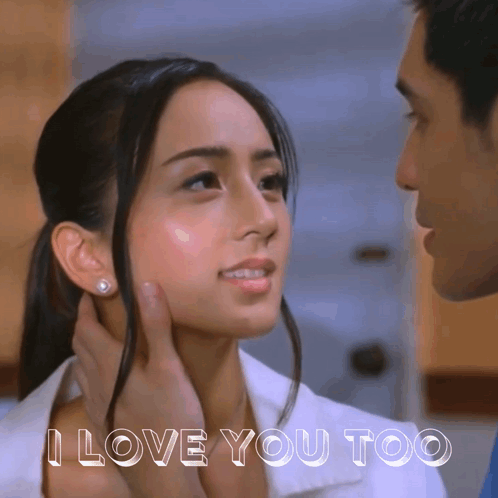 A Man Touching A Woman 'S Face With The Words I Love You Too Below GIF