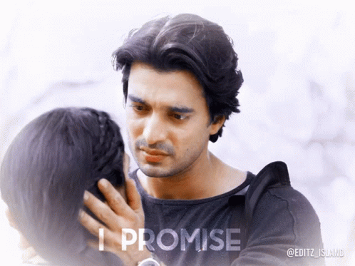 A Man Touching A Woman 'S Face With The Words " I Promise " Below Him GIF