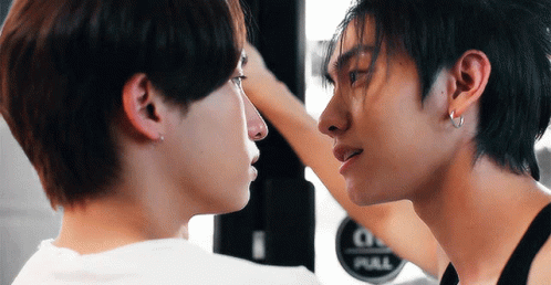 Man Touching Another's Face With Pull Sign GIF