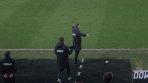 A Man Walking On A Soccer Field Wearing A Shirt That Says ' Do ' On It GIF