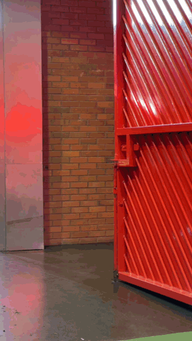 a man walking through a red gate with the words " good morning " on the bottom