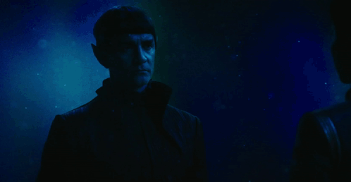 A Man Waves His Hand With The Words Live Long Behind Him GIF