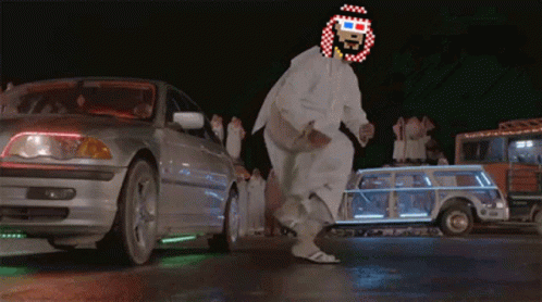 A Man Wearing 3D Glasses Is Dancing In A Parking Lot GIF