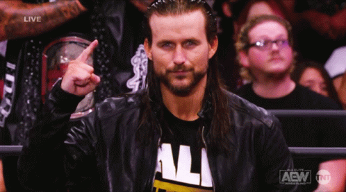 A Man Wearing A Aew Shirt Is Pointing Up GIF