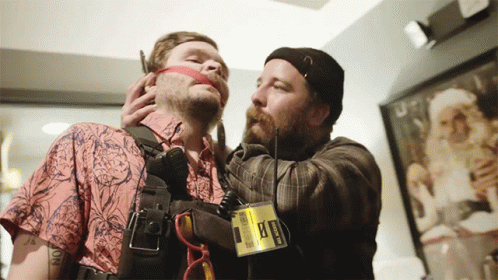 A Man Wearing A Badge That Says ' Ambulance ' On It GIF