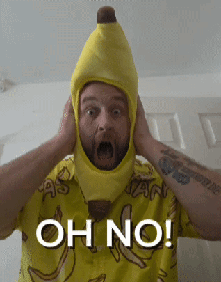A Man Wearing A Banana Hat And A Shirt That Says Oh No On It GIF