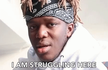 A Man Wearing A Bandana And A Hoodie Is Struggling Here . GIF