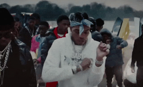 A Man Wearing A Bandana And A Hoodie That Says Baby On It GIF