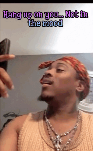 A Man Wearing A Bandana And A Necklace Says " Hang Up On You ... Not In The Mood " GIF