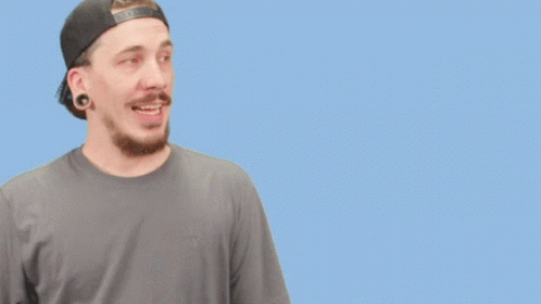 a man wearing a baseball cap and a gray shirt says keep it safe