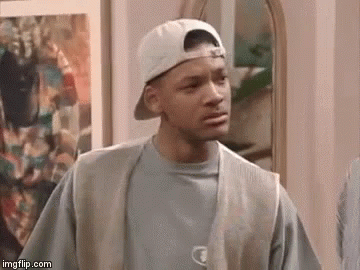 A Man Wearing A Baseball Cap And Vest Is Standing In Front Of A Mirror . GIF