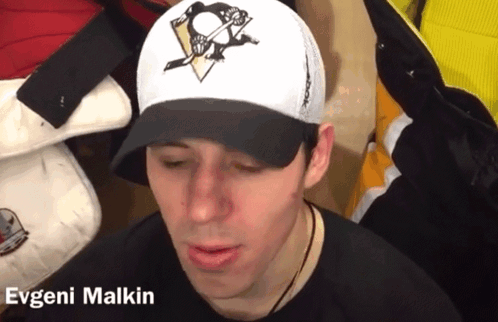 A Man Wearing A Baseball Cap With The Name Evgeni Malkin On It GIF