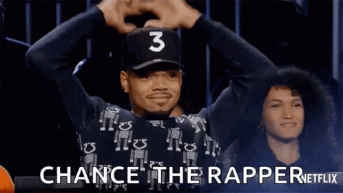 A Man Wearing A Baseball Cap With The Number 3 On It Is Holding His Hands In The Air . GIF