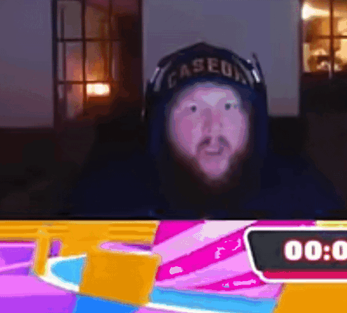 A Man Wearing A Baseball Cap With The Word Caseua On It GIF