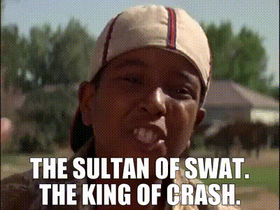 A Man Wearing A Baseball Cap With The Words The Sultan Of Swat The King Of Crash Written On It GIF