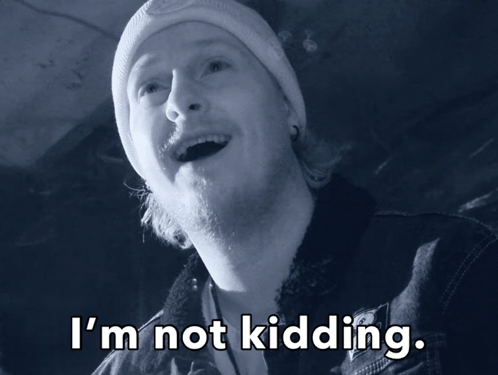 A Man Wearing A Beanie And A Denim Jacket Says " I 'M Not Kidding " GIF
