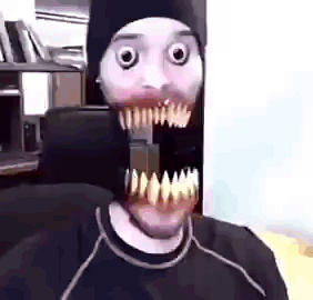 Man In Beanie And Mask With Big Teeth GIF