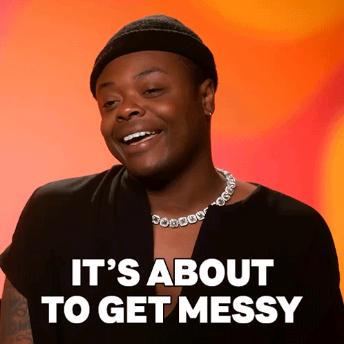 A Man Wearing A Beanie And A Necklace With The Words It 'S About To Get Messy GIF