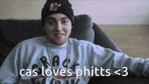 A Man Wearing A Beanie And A Sweater With The Words Cas Loves Phitts < 3 On It GIF