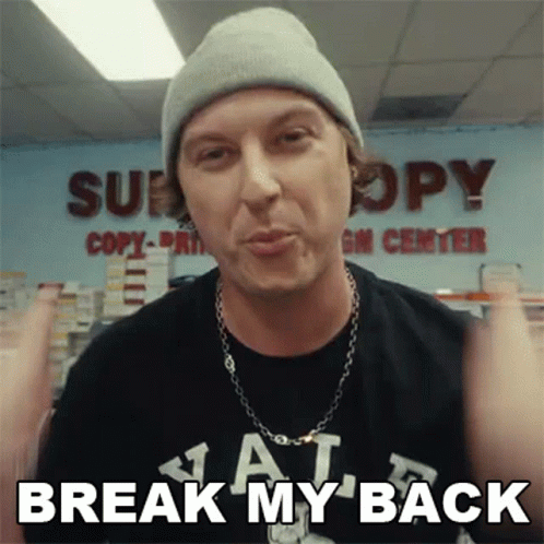 A Man Wearing A Beanie And A T-Shirt With The Words Break My Back On It GIF