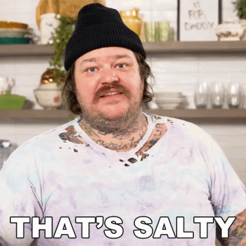 A Man Wearing A Beanie And A White Shirt Says That 'S Salty GIF