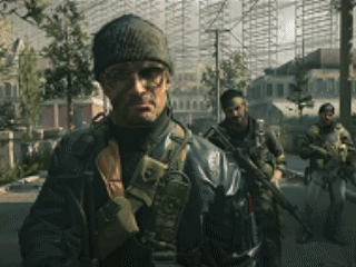 A Man Wearing A Beanie And Glasses Is Standing In Front Of A Group Of Soldiers GIF