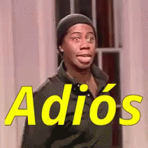 A Man Wearing A Beanie Is Standing In Front Of A Sign That Says Adiós GIF
