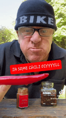 A Man Wearing A Beanie That Says Bike GIF