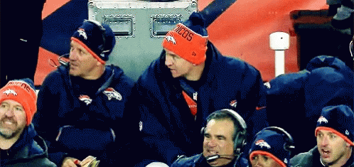 a man wearing a beanie that says broncos
