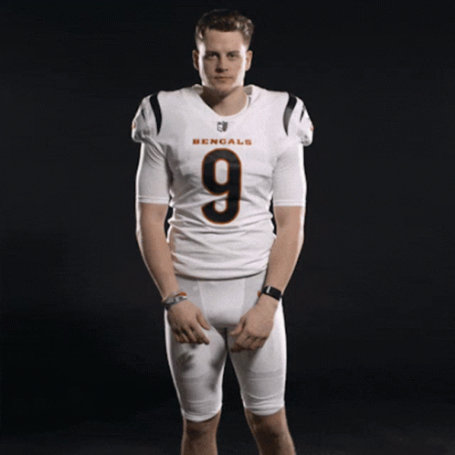 A Man Wearing A Bengals Jersey With The Number 9 GIF