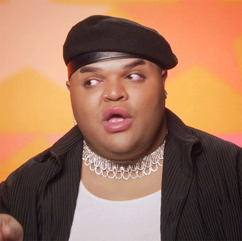 Man Wearing Beret And Choker Making Funny Face GIF