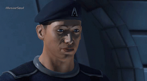 A Man Wearing A Beret With The Letter A On It Looks At The Camera GIF