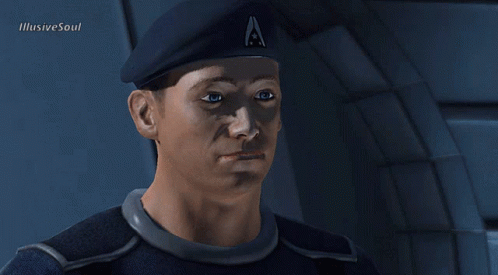 A Man Wearing A Beret With The Letter A On It Looks At The Camera GIF