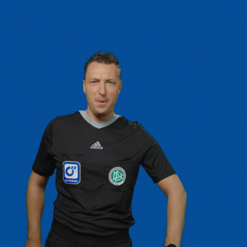 A Man Wearing A Black Adidas Shirt Holds Up A Yellow Card GIF