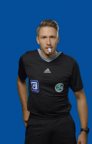 A Man Wearing A Black Adidas Shirt Holds Up An Orange Card GIF